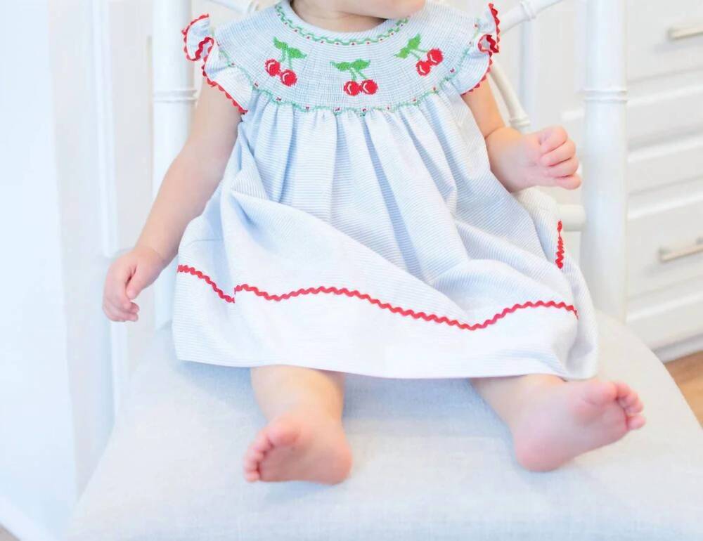 NEW MARCO & LIZZY cherries hand smocked bishop dress in blue/ red
